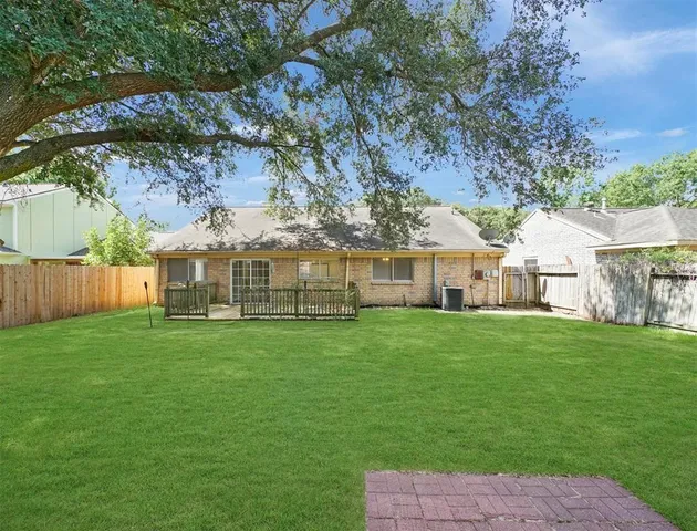 a view of a big yard with a house