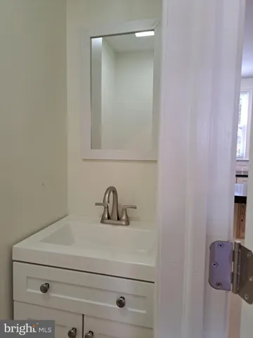 a bathroom with a sink and mirror