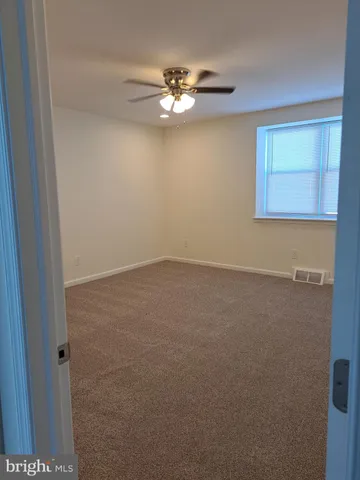 a view of a livingroom with a fan