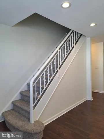 a view of entryway with wooden floor