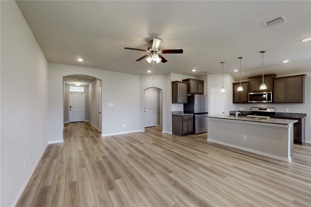 2010 Chief Street Bryan, TX 77807 - Photo 14 of 29 a view of kitchen with cabinets stainless steel appliances and wooden floor
