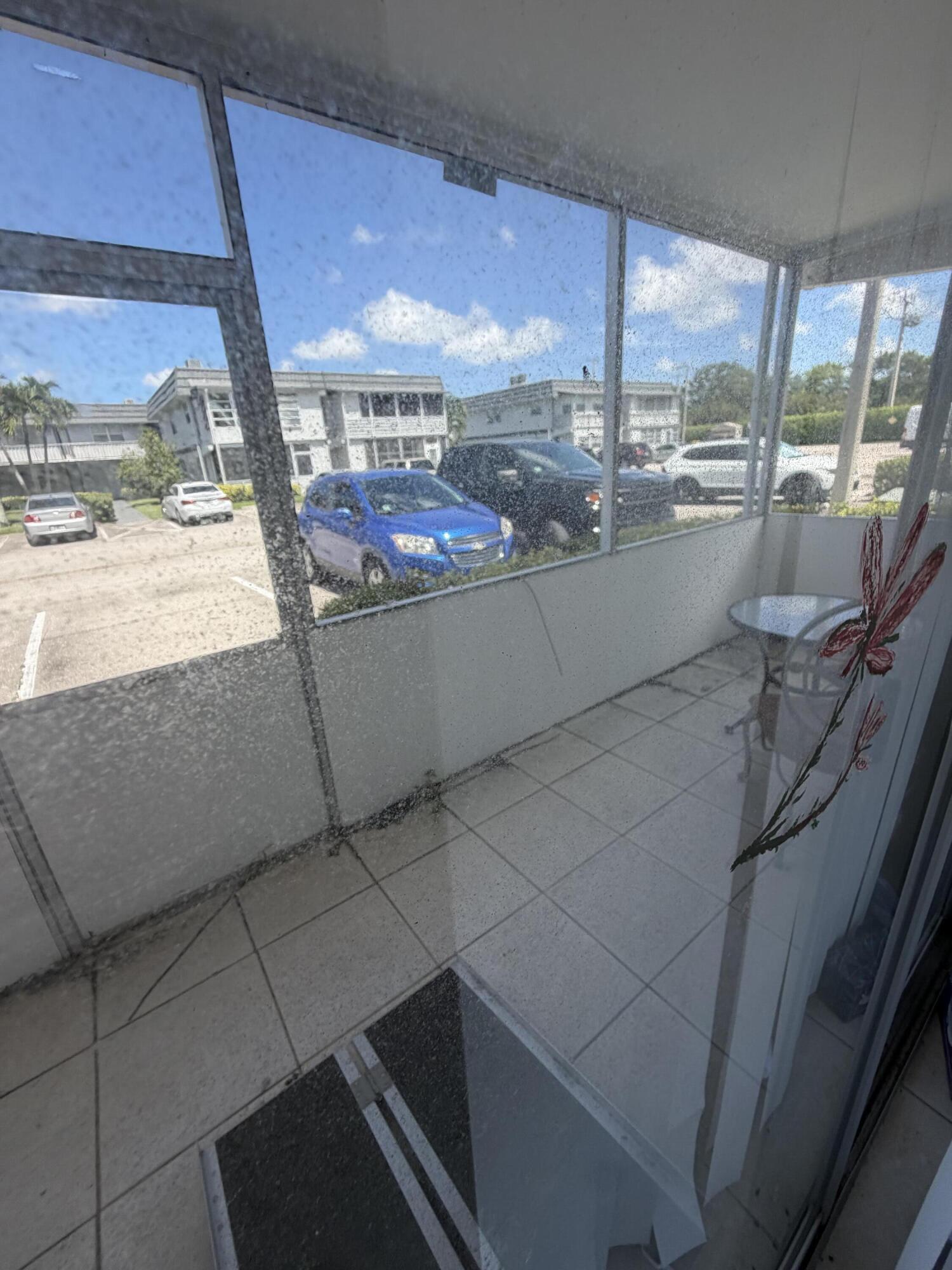 679 Saxony Way Delray Beach, FL 33446 - Photo 10 of 15 Covered screened near parking