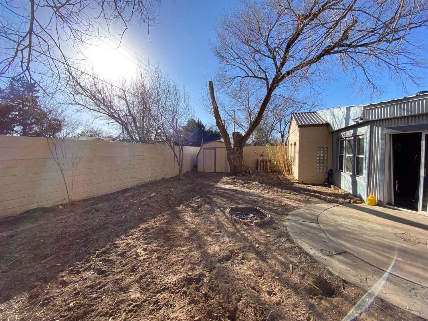 2611 28th Street Lubbock, TX 79410 - Photo 21 of 22 a view of a backyard with a large tree