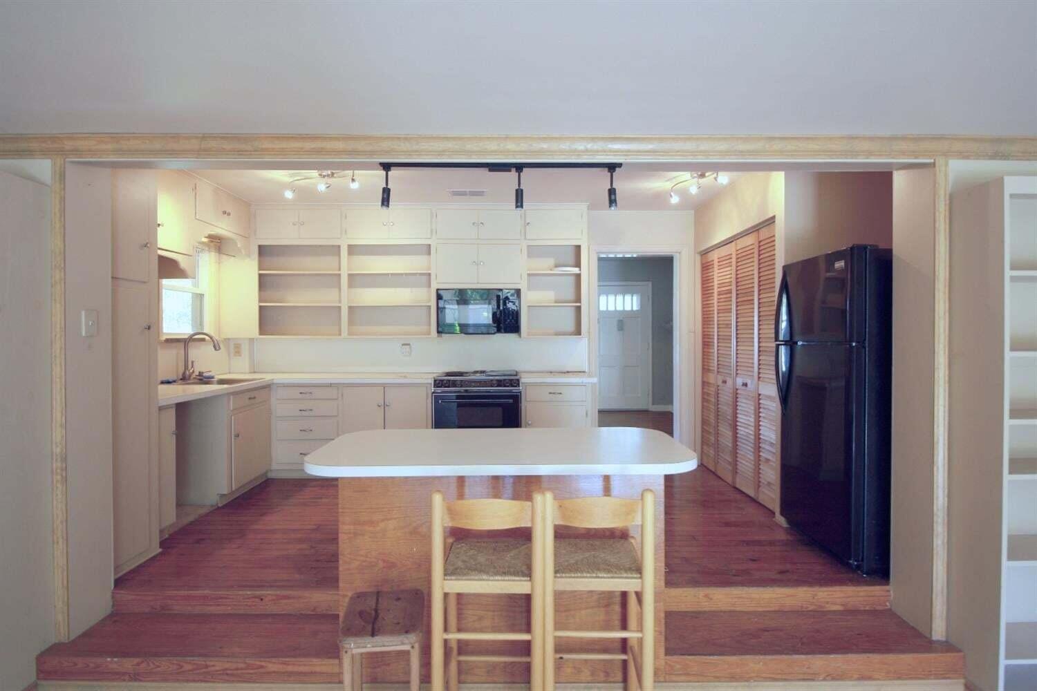 2611 28th Street Lubbock, TX 79410 - Photo 8 of 22 a kitchen with a refrigerator and countertop