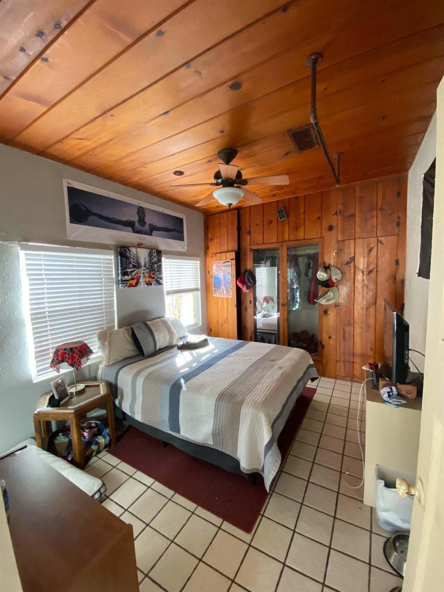 2611 28th Street Lubbock, TX 79410 - Photo 10 of 22 a bedroom with a bed and a mirror