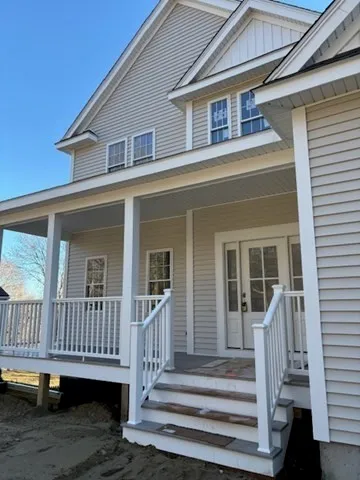 a front view of a house with a porch