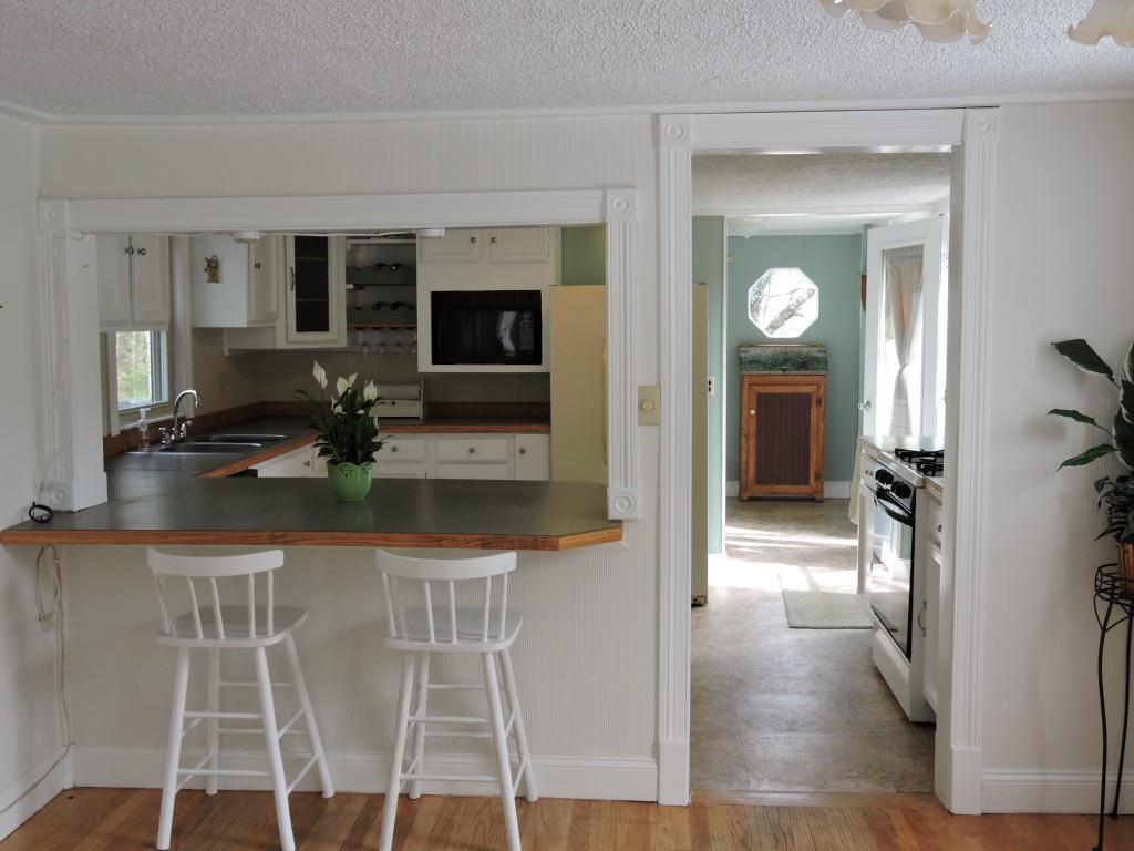 885 Chadbourne Road Standish, ME 04084 - Photo 11 of 35 Dining room to kitchen in main home.