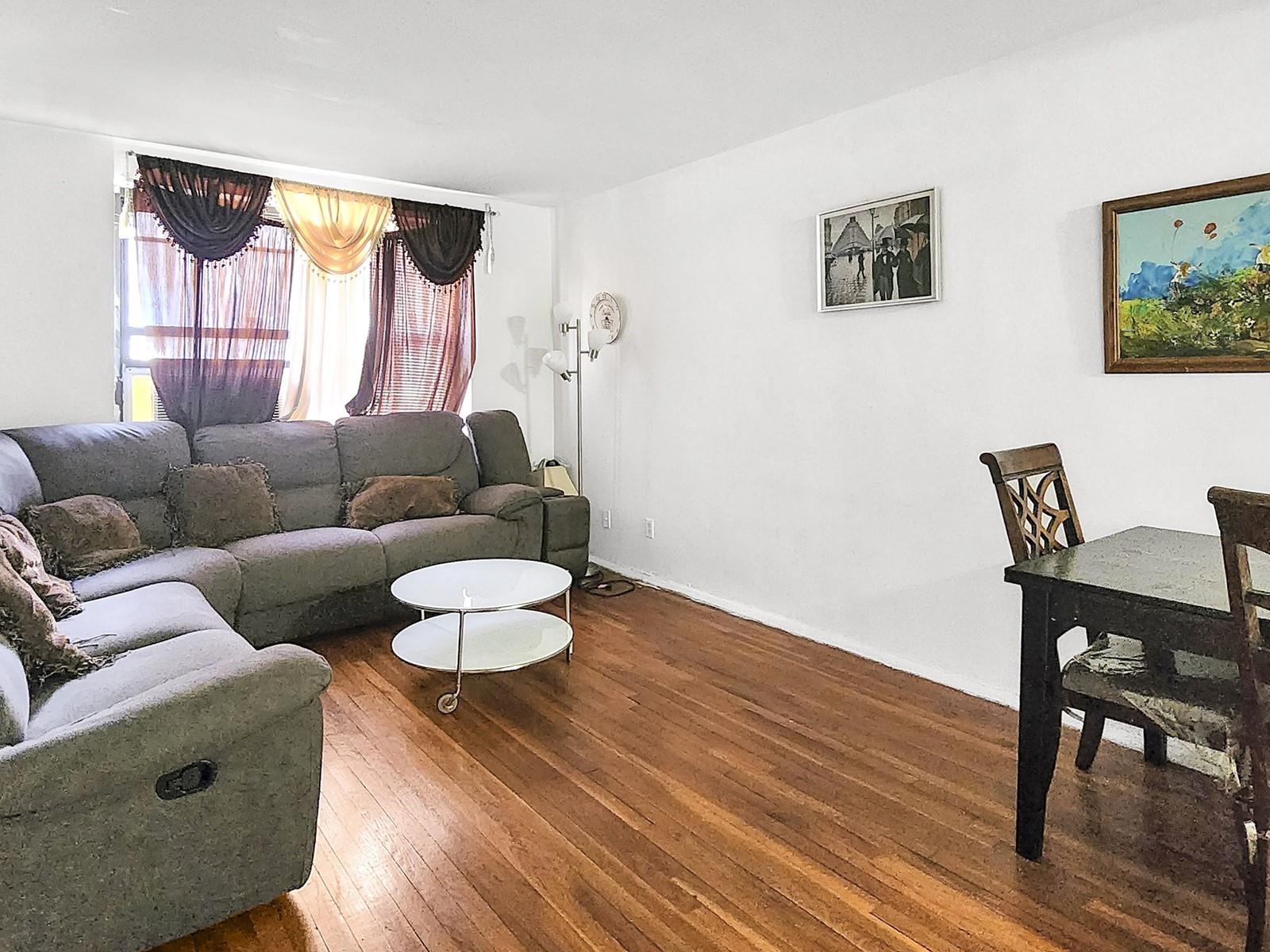 139-15 28th Road, Unit 1F Queens, NY 11354 - Photo 2 of 6 Living room with wood-type flooring