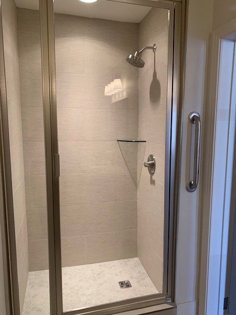 326 West Main Street, Unit 1 Lebanon, TN 37087 - Photo 12 of 63 a bathroom with a glass shower door