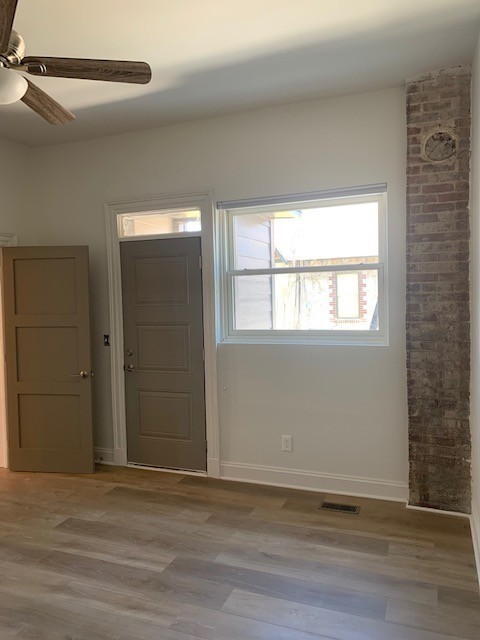 326 West Main Street, Unit 1 Lebanon, TN 37087 - Photo 14 of 63 a view of an empty room with wooden floor and a window