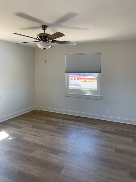326 West Main Street, Unit 1 Lebanon, TN 37087 - Photo 38 of 63 an empty room with wooden floor fan and windows