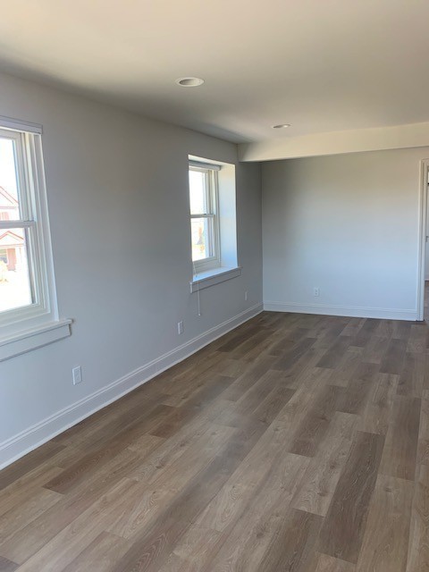 326 West Main Street, Unit 1 Lebanon, TN 37087 - Photo 59 of 63 an empty room with wooden floor and windows