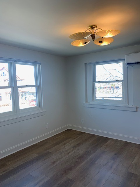 326 West Main Street, Unit 1 Lebanon, TN 37087 - Photo 60 of 63 an empty room with wooden floor and windows