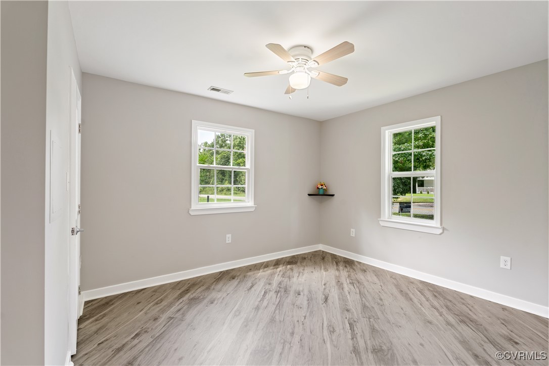 3605 Dupuy Road Petersburg, VA 23803 - Photo 8 of 31 Spare room featuring plenty of natural light, wood
