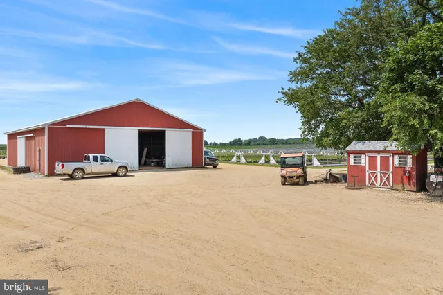 a view of a house with a yard and garage