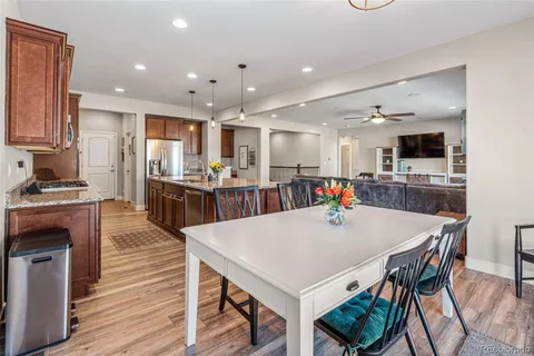 a large kitchen with a table and chairs