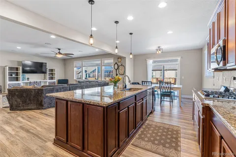 a utility room with granite countertop cabinets washer and dryer