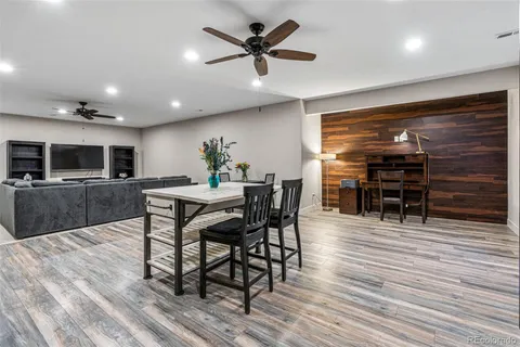 a view of a dining room with furniture and wooden floor