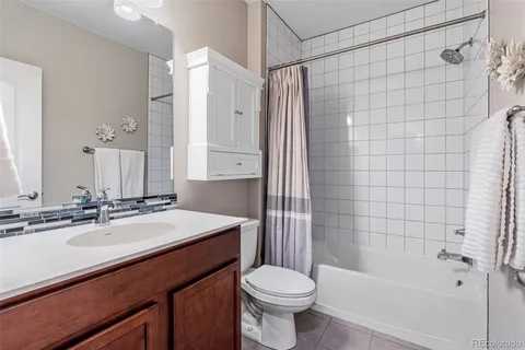 a view of a chair and table in backyard