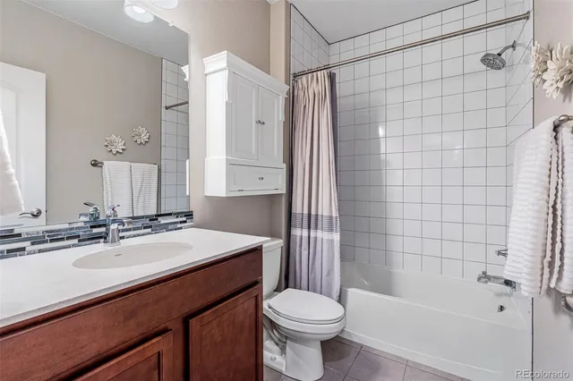 a view of a chair and table in backyard