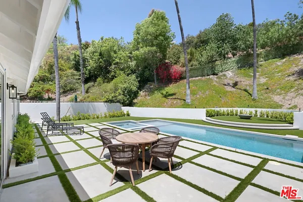 a view of yard with patio