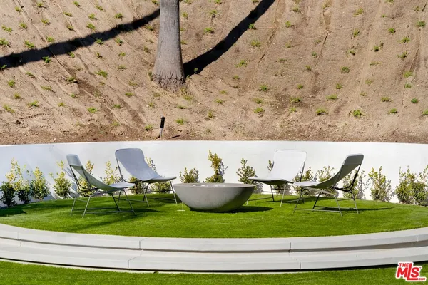 a aerial view of a house with outdoor seating