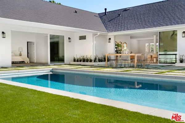 a view of a living room and kitchen