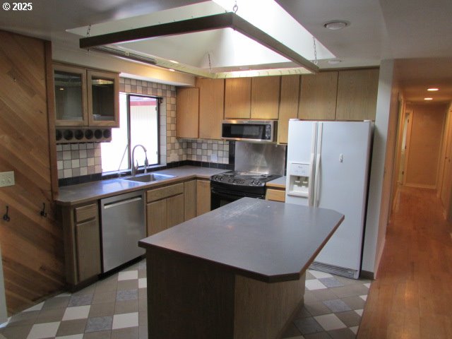 10285 South Rosewood Way Molalla, OR 97038 - Photo 11 of 39 a kitchen with stainless steel appliances a kitchen island a stove a refrigerator and a sink