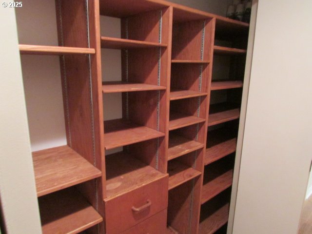 10285 South Rosewood Way Molalla, OR 97038 - Photo 21 of 39 a view of walk in closet with empty racks