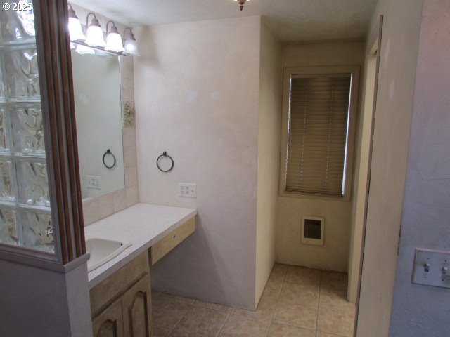10285 South Rosewood Way Molalla, OR 97038 - Photo 27 of 39 a bathroom with a sink a light fixture and a glass door