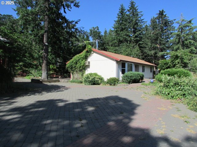 10285 South Rosewood Way Molalla, OR 97038 - Photo 8 of 39 a house with trees in the background