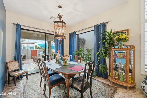 a view of a dining room with furniture window and outside view