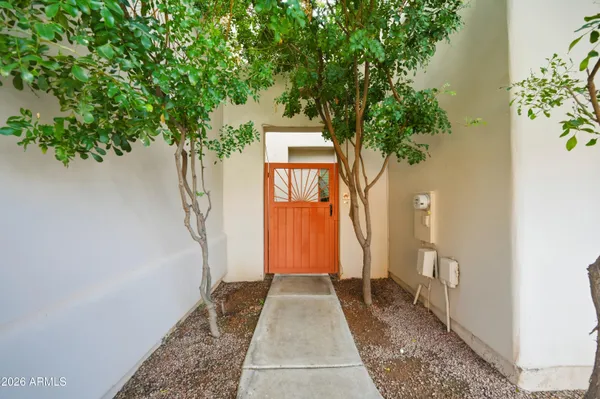 a living room with furniture a rug and a chandelier