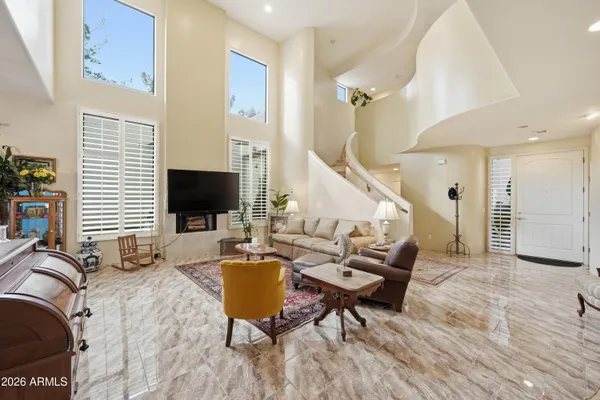 a living room with furniture and a table
