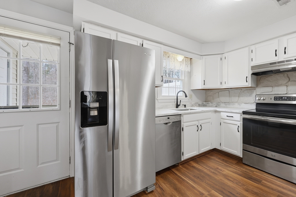 13 Pullard Road, Unit 31 Grafton, MA 01519 - Photo 11 of 34 a kitchen with stainless steel appliances a refrigerator sink and cabinets