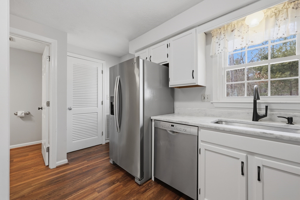 13 Pullard Road, Unit 31 Grafton, MA 01519 - Photo 12 of 34 a kitchen with a refrigerator sink and cabinets