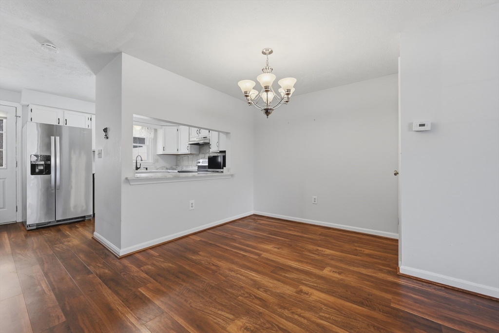 13 Pullard Road, Unit 31 Grafton, MA 01519 - Photo 13 of 34 a view of kitchen with refrigerator and wooden floor