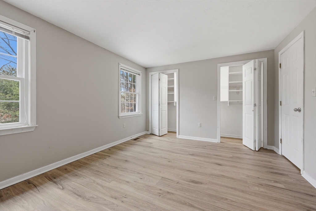 13 Pullard Road, Unit 31 Grafton, MA 01519 - Photo 15 of 34 a view of an empty room with wooden floor and a window