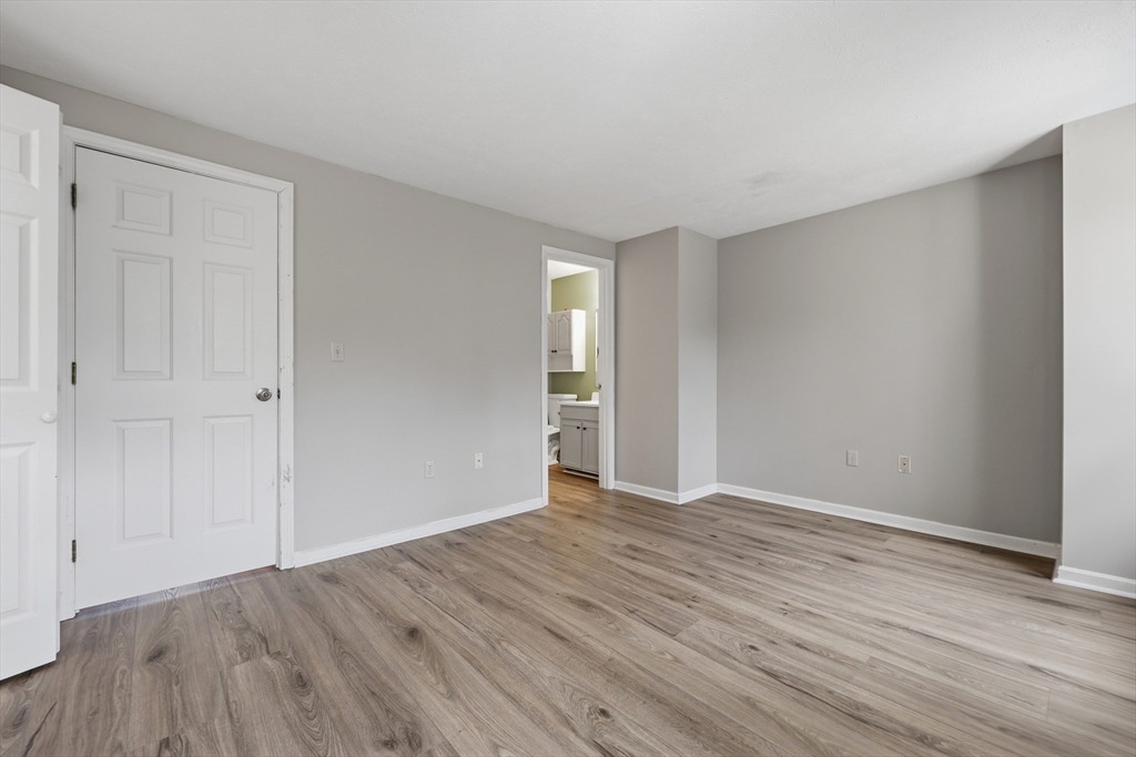 13 Pullard Road, Unit 31 Grafton, MA 01519 - Photo 17 of 34 a view of an empty room with wooden floor and closet