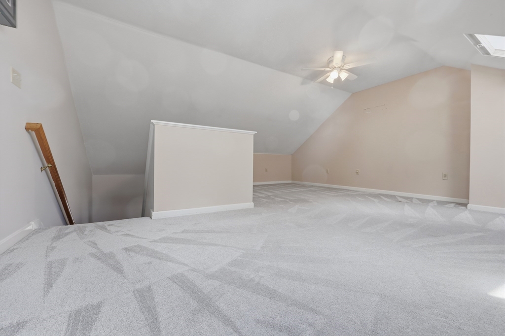 13 Pullard Road, Unit 31 Grafton, MA 01519 - Photo 19 of 34 a view of an empty room with a chandelier fan