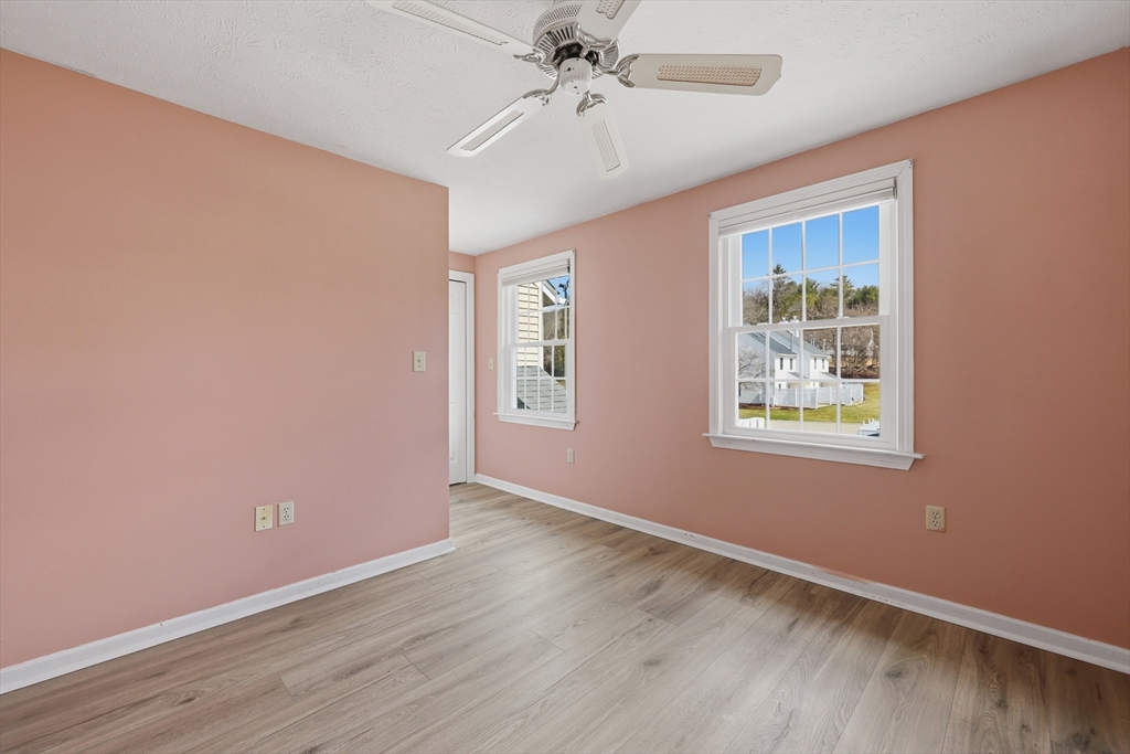 13 Pullard Road, Unit 31 Grafton, MA 01519 - Photo 23 of 34 wooden floor in an empty room with a window