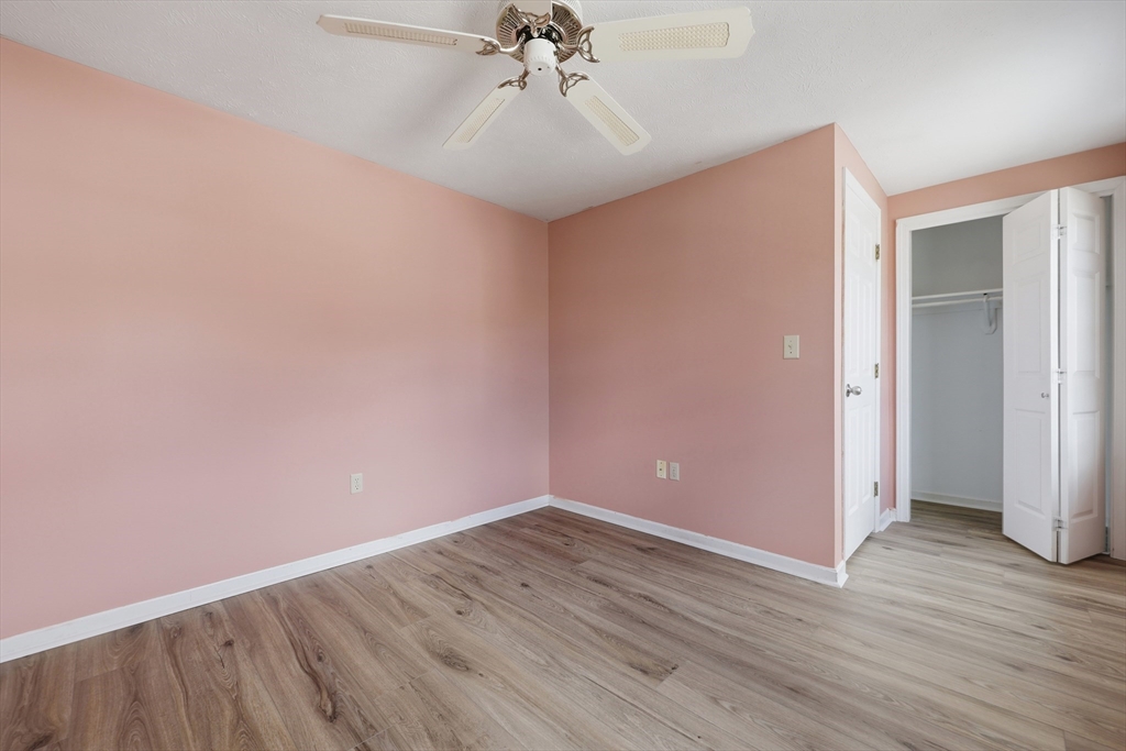 13 Pullard Road, Unit 31 Grafton, MA 01519 - Photo 24 of 34 wooden floor in an empty room with a window