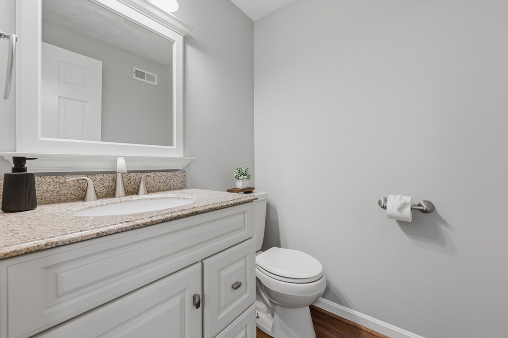 13 Pullard Road, Unit 31 Grafton, MA 01519 - Photo 25 of 34 a bathroom with a granite countertop toilet and sink