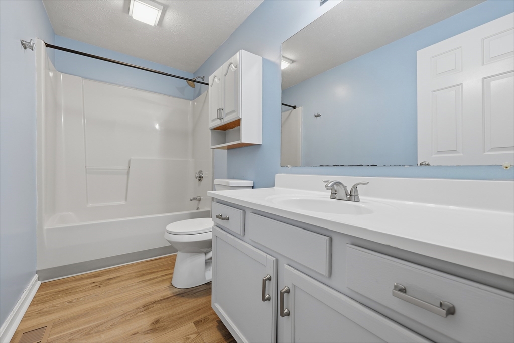 13 Pullard Road, Unit 31 Grafton, MA 01519 - Photo 27 of 34 a bathroom with a sink a toilet and shower