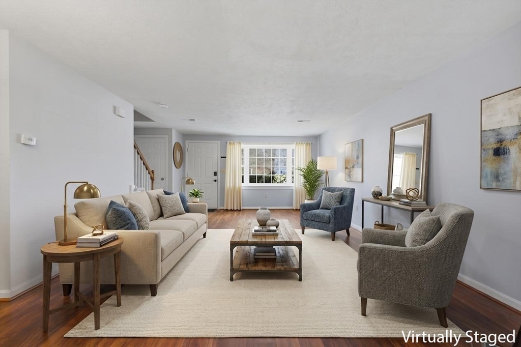 13 Pullard Road, Unit 31 Grafton, MA 01519 - Photo 3 of 34 a living room with furniture and a wooden floor
