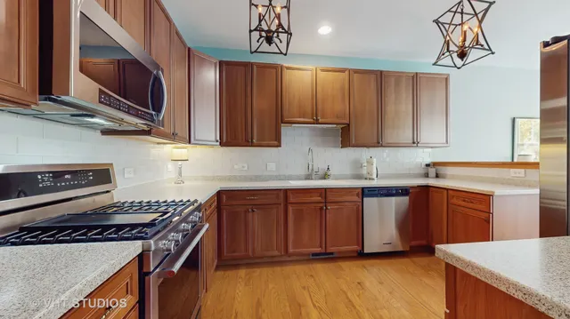 a spacious bathroom with a sink a mirror and a shower