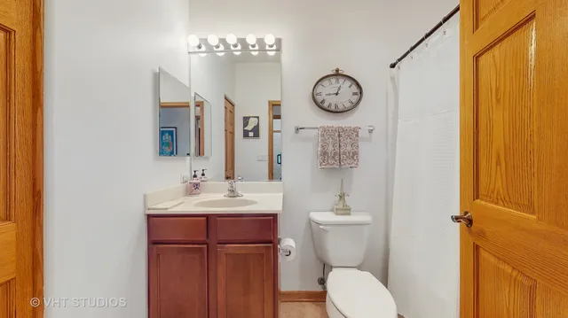 a view of a chair and tables in the back yard of the house