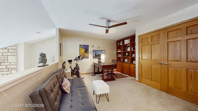 a front view of a house with a yard and trees