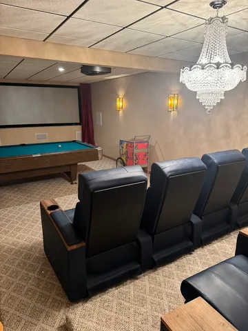 a backyard of a house with a yard and outdoor seating