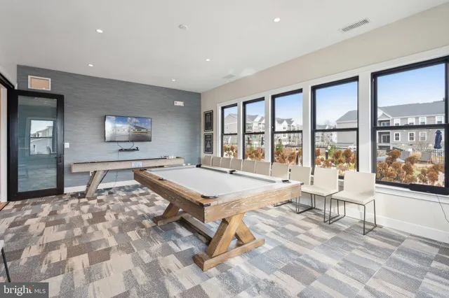 a swimming pool with outdoor seating and yard